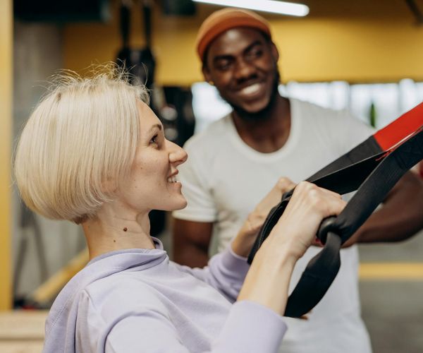 Group of men encouraging each other during a workout session.