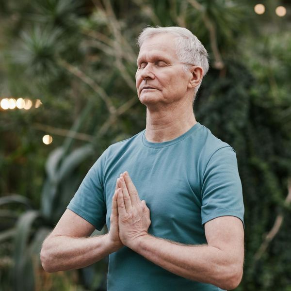 Man meditating after a workout, showing peace and balance.